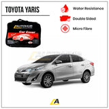 Toyota Yaris car with a car cover and features listed on a white background