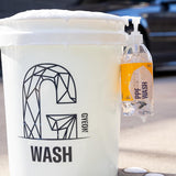 White bucket with 'GYON' logo and a bottle of 'PPF Wash' on a blurred background