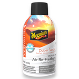 Meguar's Dubai Sands Air Re-Fresher whole car odor fighting mist in a 2 fl oz spray bottle, featuring a sunset graphic label and a black cap.
