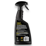 A black spray bottle of Carpet Pro Carpet & Spot Remover, shown from the back to display the label. The bottle has a black trigger spray mechanism and is photographed on a clean white background.