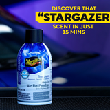 Meguiar's Stargazer air freshener bottle with promotional text on a blurred car interior background