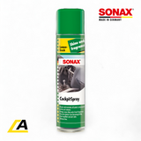 A can of Sonax Cockpit Spray with a green lid and label featuring text and a picture of a car interior. The label mentions 'Lemon Fresh' and the product's effects on plastics.