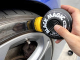 Autohub Pakistan Soft99 Black Magic tire coating being applied to a car tire sidewall with an integrated sponge applicator